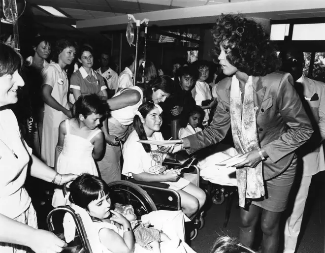 Each year she would throw a Christmas party, where she would invite underprivileged children from her hometown of Newark, New Jersey in order to bring them much needed festive happiness (pictured in 1988)