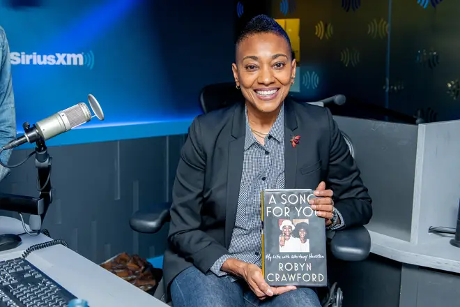 Robyn Crawford with her book in 2019