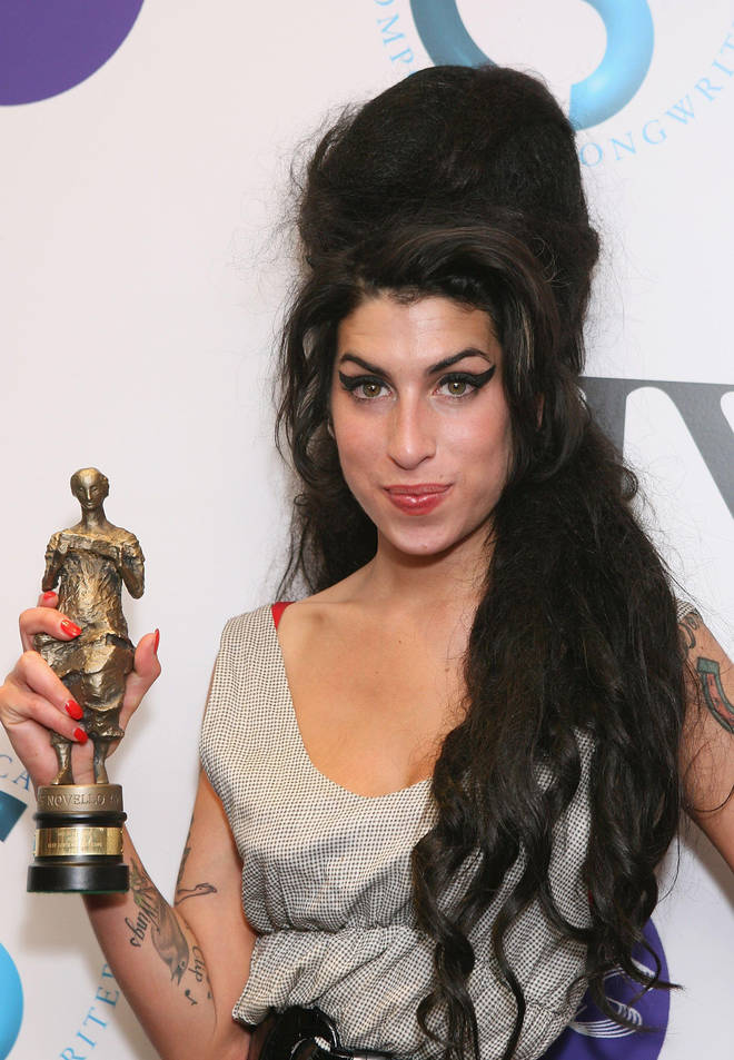 Amy Winehouse pictured winning an Ivor Novello Award in 2007