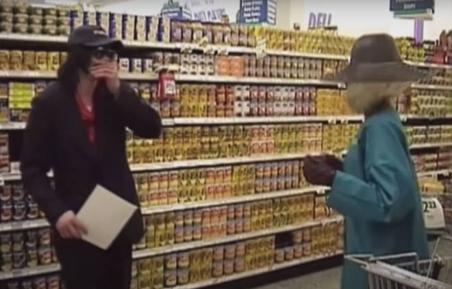 "Eventually I started recognising people, like the woman in the blonde wig is my nanny," he says, as the video shows Michael laughing with an elaborately dressed blonde woman in the aisles.