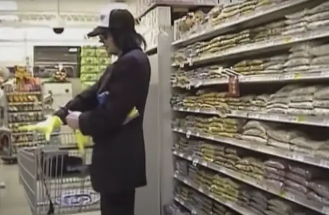 Michael Jackson tries on a pair of yellow Marigolds