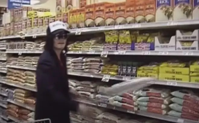 Michael Jackson seen throwing a tin foil frisbee in the shopping aisle
