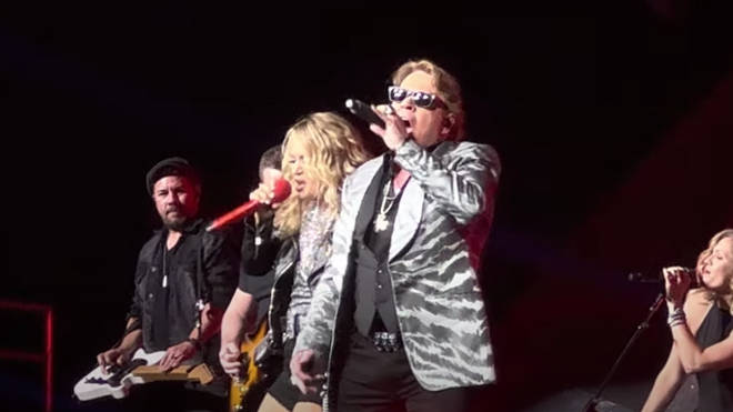 The crowd then went wild as the Guns N Roses frontman joined Carrie on stage for a spectacular duet of 'Welcome to the Jungle'.