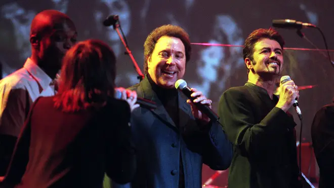 Tom Jones and George Michael singing on stage with The Pretenders' Chrissie Hynde during the Concert For Linda. (Photo by Dave Hogan/Getty Images)