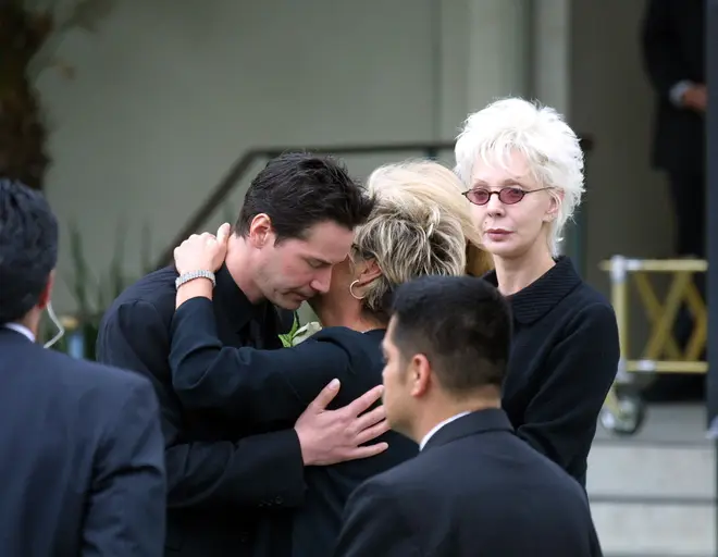Keanu being comforted at Jennifer's funeral. (Photo by Bauer-Griffin/GC Images)