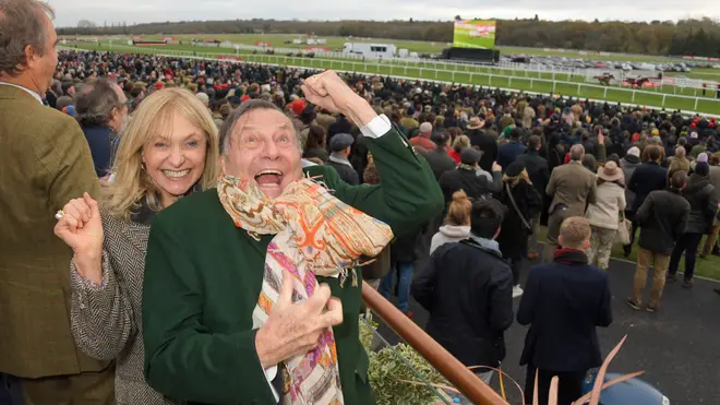 Barry Humphries with his current wife Lizzie Spender at the races in 2021. (Photo by David M. Benett/Dave Benett/Getty Images for Newbury Racecourse)