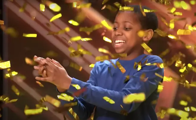 When Bayoh was finished singing the captivating song, the audience and judges all erupted into a standing ovation before Simon Cowell pressed the Golden Buzzer (pictured)