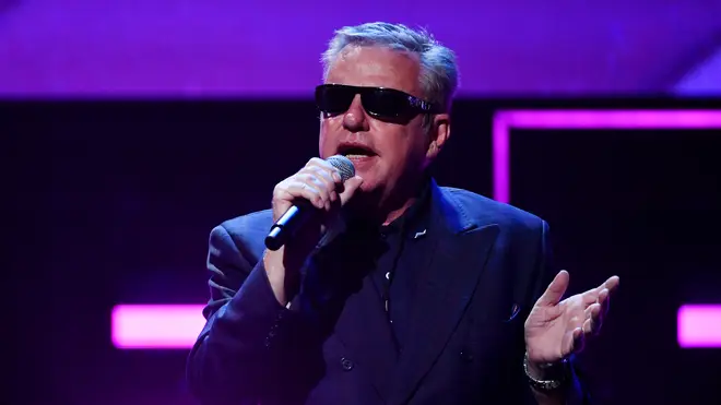 Suggs performing with Madness