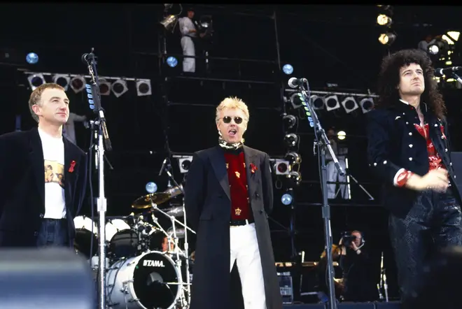 John Deacon, Roger Taylor and Brian May on stage at the Freddie Mercury tribute concert