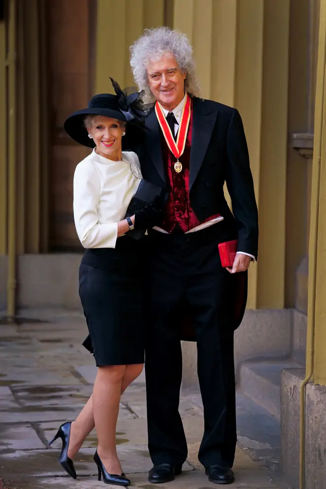 Anita and Brian after he was given a knighthood. (Photo by VICTORIA JONES/POOL/AFP via Getty Images)