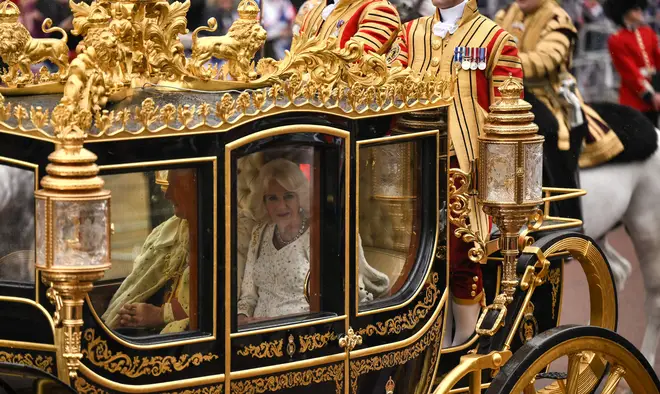 Britain's King Charles III and Britain's Camilla, Queen Consort ride in the Diamond Jubilee State Coach