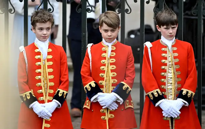 Prince George (C) stands at the Coronation of King Charles III and Queen Camilla