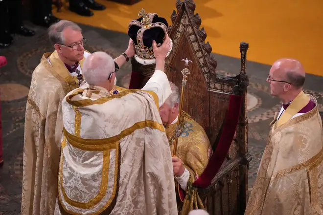 The Archbishop of Canterbury Justin Welby places the St Edward's Crown onto the head of Britain's King Charles III during the Coronation