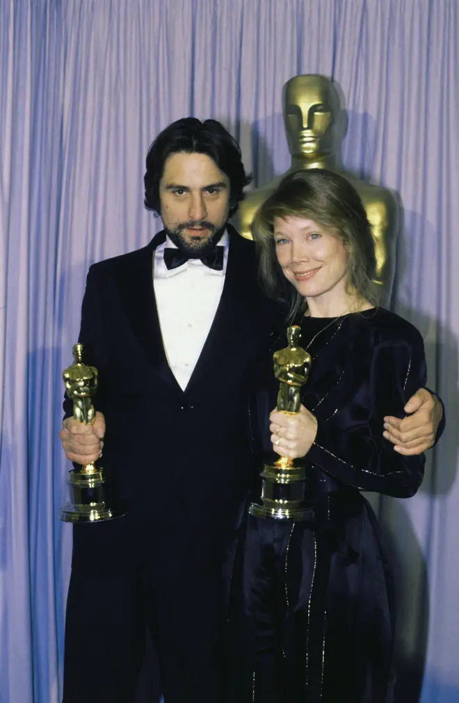 Robert De Niro pictured with Sissy Spacek in 1981 as he shows off the Oscar he won for Best Actor in Raging Bull.