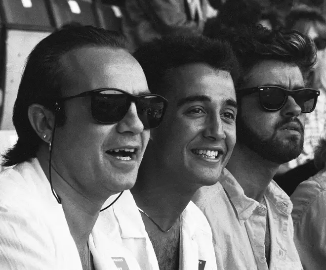 Midge Ure, Andrew Ridgeley and George Michael in the audience during the opening of Live Aid at Wembley Stadium, July 13, 1985