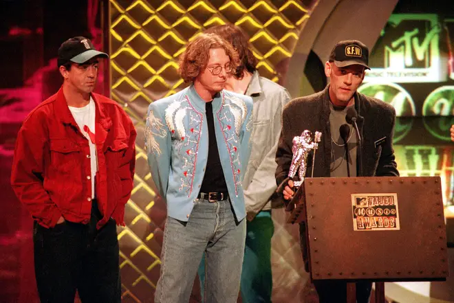 R.E.M. accepting the award for Best Group Video at the MTV Video Music Awards in 1994. (AP Photo/Bebeto Matthews)