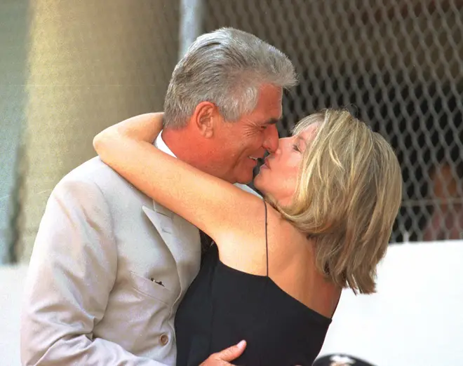 US singer and actress Barbra Streisand gives her husband actor James Brolin a kiss during his Hollywood star installation on the Walk of Fame
