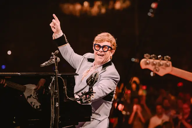 Elton John salutes his band in Stockholm