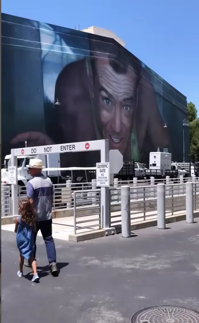 The footage shows Bruce Willis, 68, wander around the exhibition with his two young daughters, Mabel, 11, and Evelyn, 8.