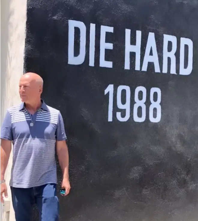 Bruce Willis' wife has shared a throwback video of Bruce Willis and his youngest children visiting the Die Hard set in 2018.