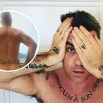 Robbie Williams strips off to show his tattoos