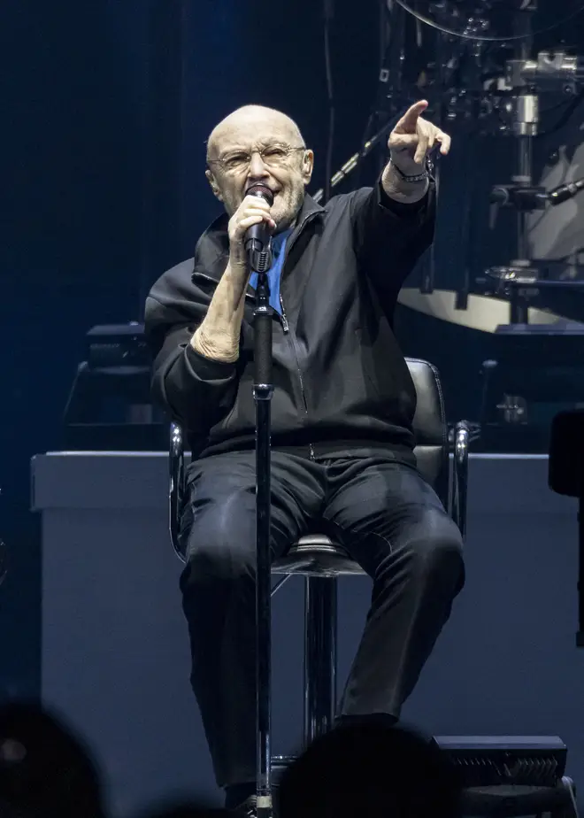 Phil Collins had to perform sat down throughout Genesis' final tour together. (Photo by Scott Legato/Getty Images)