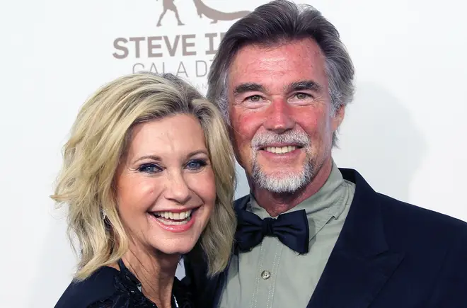 Olivia Newton-John's husband has opened up about his year without his late wife and how he celebrated their first wedding anniversary without her.