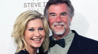 Olivia Newton-John's husband has opened up about his year without his late wife and how he celebrated their first wedding anniversary without her.