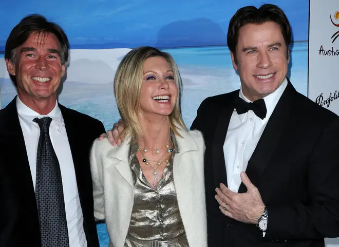 He recalls he had never even seen Olivia's iconic movie Grease when he met the star in the early 2000's – although he did later watch it on John Travolta's private jet (Pictured: John Easterling, Olivia Newton-John and John Travolta)