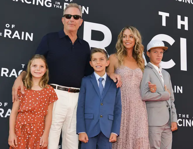 Kevin Costner and Christine Baumgartner and their family