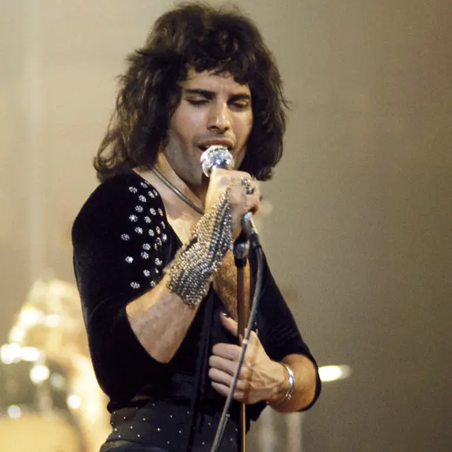 Freddie Mercury performs with Queen in 1975