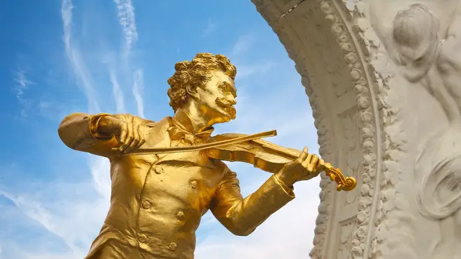 The golden statue of Johann Strauss, by Edmund Hellmer, in Stadpark in Vienna.