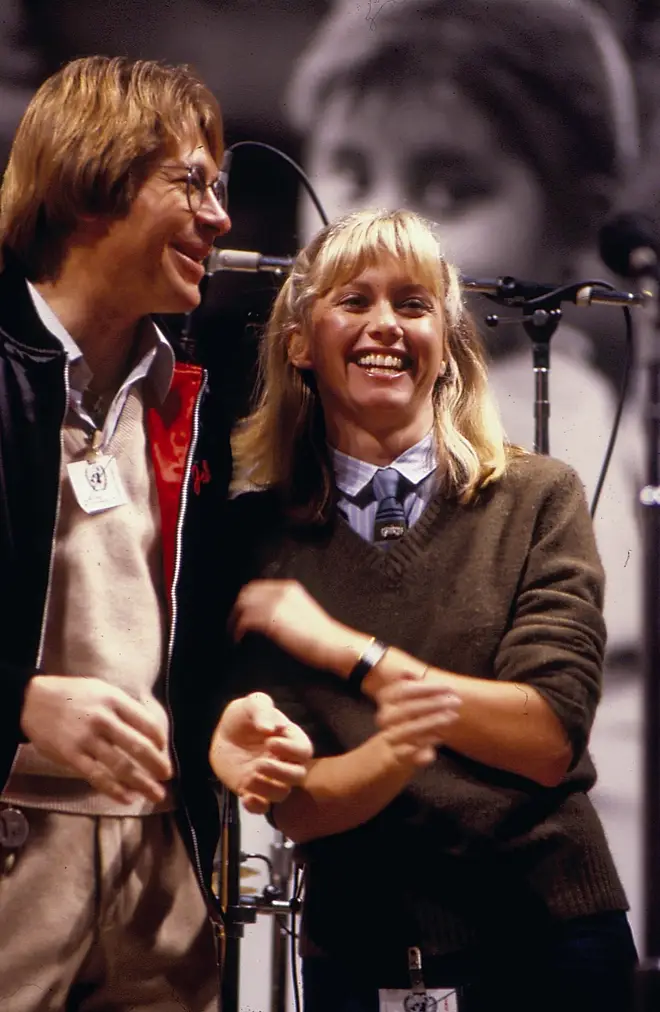 Olivia Newton John and John Denver (pictured here in 1980) became life-long friends. (Photo by Richard E. Aaron/Redferns/Getty Images)