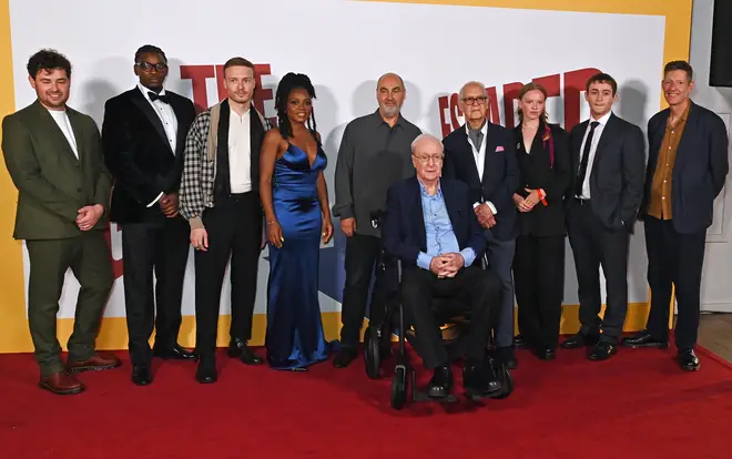 The Italian Job star donned a crisp blue shirt, navy blazer and black trousers and was seated on the red carpet surrounded by colleagues, friends and family.