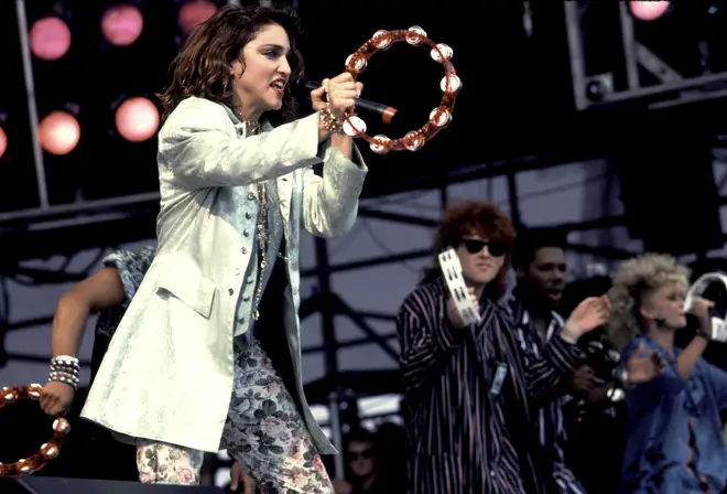 Madonna and Nile Rodgers appeared on stage with Thompson Twins during the Live Aid concert in Philadelphia. (Photo by Paul Natkin/Getty Images)