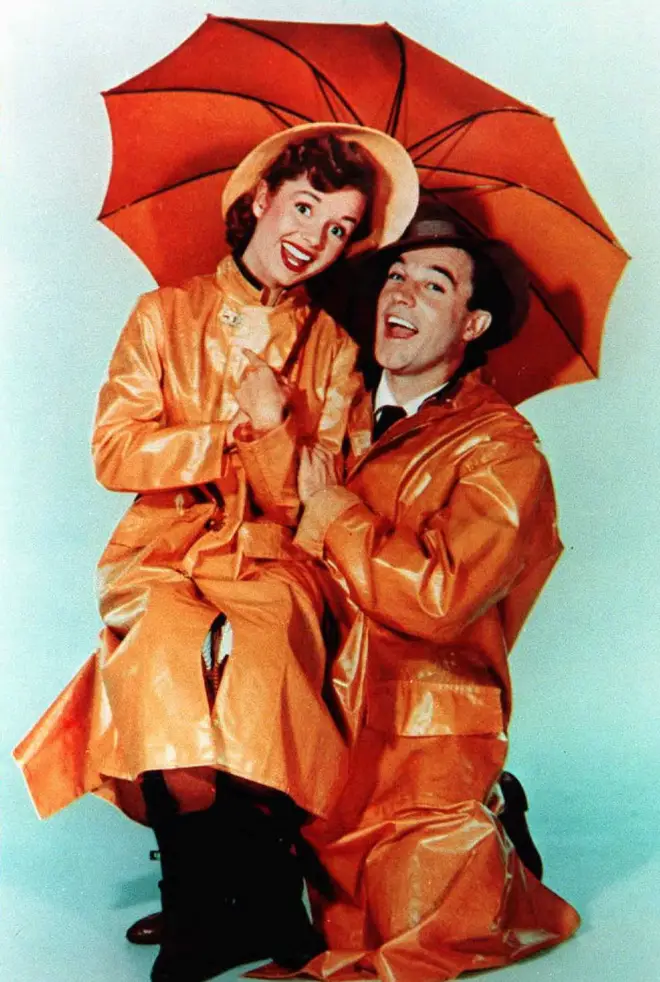 "I’d get up and her mother, Debbie Reynolds, would shout: &squot;Hey Charlie – you wanna drink?&squot; Blunt recalls. (Pictured: Reynolds and Gene Kelly in Singin&squot; In The Rain, 1952)