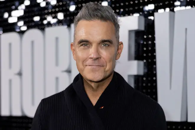 Robbie Williams poses for photographers upon arrival at the premiere for the Robbie Williams documentary on Wednesday, Nov. 1, 2023 in London. (Vianney Le Caer/Invision/AP)