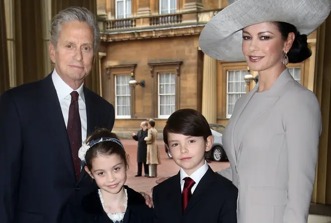 Catherine Zeta-Jones with her husband, actor Michael Douglas and their children Dylan and Carys Douglas at Buckingham Palace in 2011.