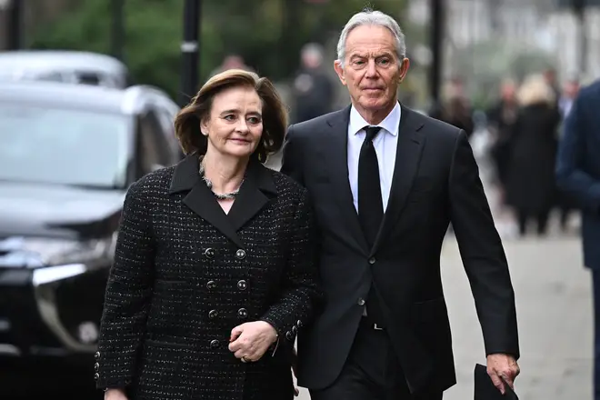 Former Prime Minister Tony Blair and wife Cherie attend the funeral of Derek Draper
