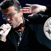 George Michael and his commemorative coin from The Royal Mint