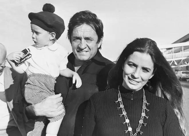 Johnny Cash and June Carter with their baby son John.