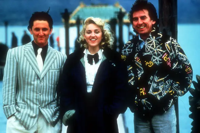 Sean Penn, Madonna, and George Harrison on set during the filming of Shanghai Surprise.