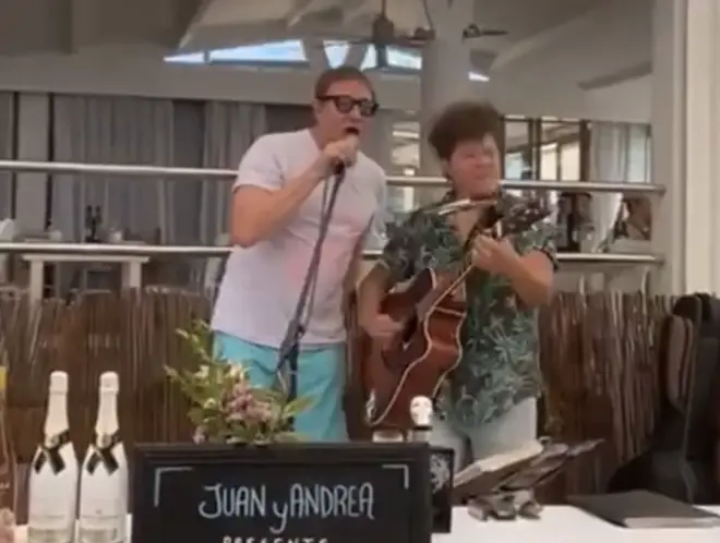 The Duran Duran singer was eating lunch on the island of Formentera, 6 miles south of Ibiza, when he got up from his table to sing his famed 1982 song 'Hungry Life a Wolf'.