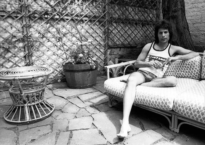 Freddie Mercury posing for a portrait in 1975 at his home in Holland Park, London