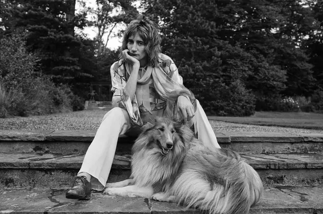 Rod Stewart pictured with his rough collie in the garden of his home at Windsor, Berkshire, 15th August 1973