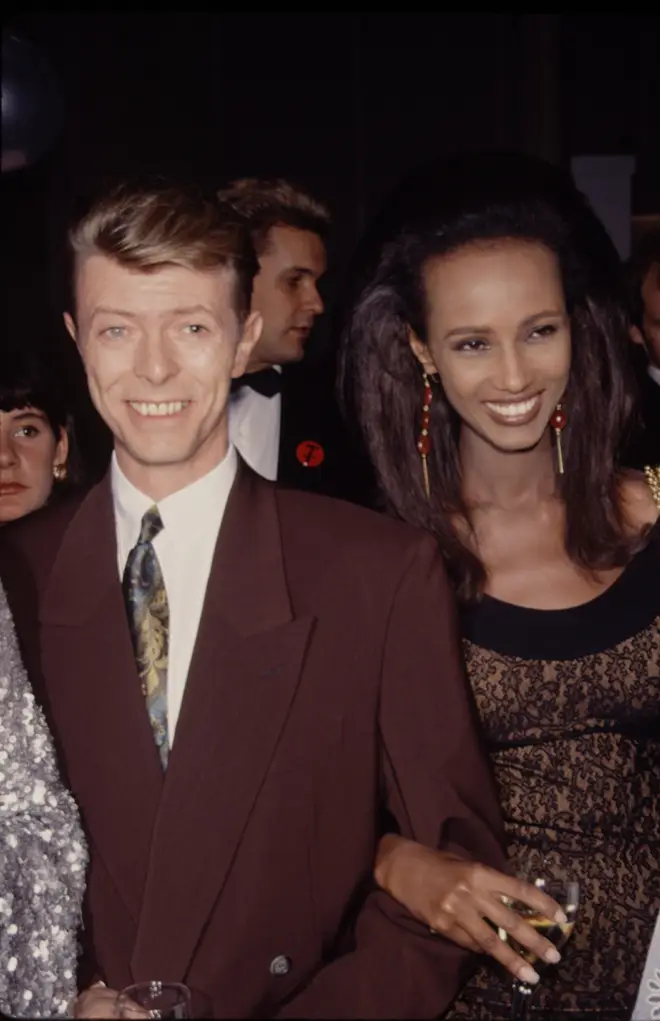 David Bowie and Iman pictured at their first public appearance together just months after meeting in 1990, attending the Seventh on Sale AIDS Benefit on November 29 at the Armory in New York City