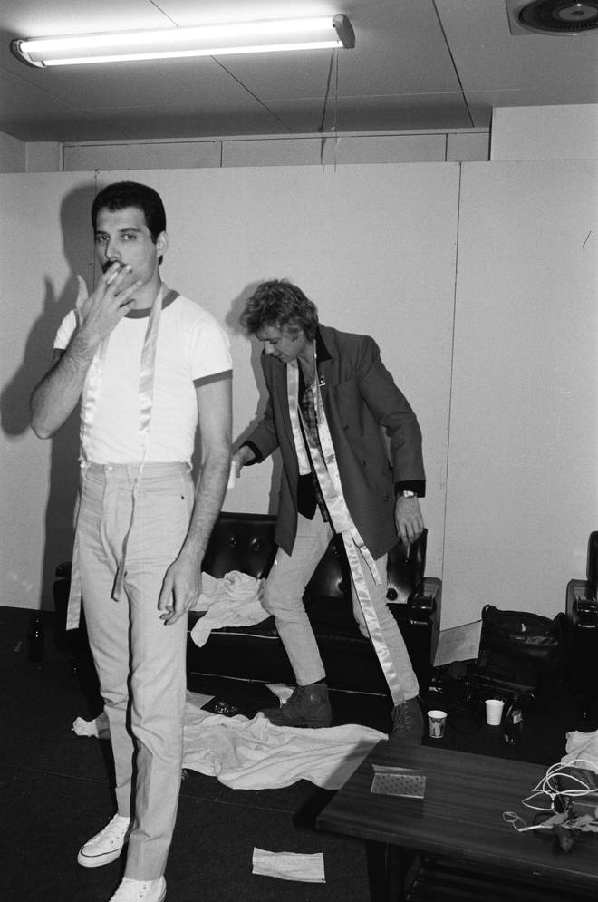 Freddie Mercury and Roger Taylor relax backstage at the Hankyu Nishinomiya Stadium after a show on the Hot Space Japan tour, Nishinomiya, Japan, 24 October 1982