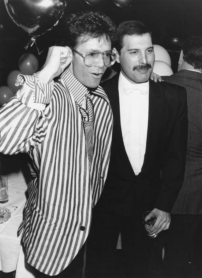 Freddie Mercury with Cliff Richard at an after-party in London on 9th April 1986.