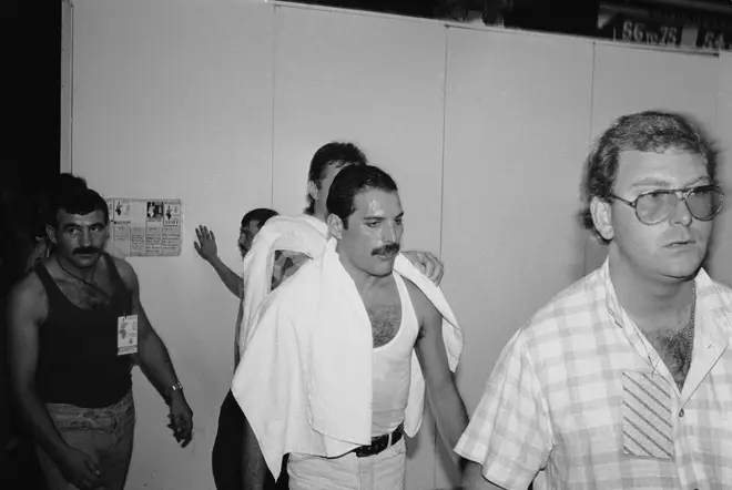 Freddie Mercury and his longterm boyfriend Jim Hutton (pictured left) backstage at the Live Aid concert at Wembley, 13th July 1985.
