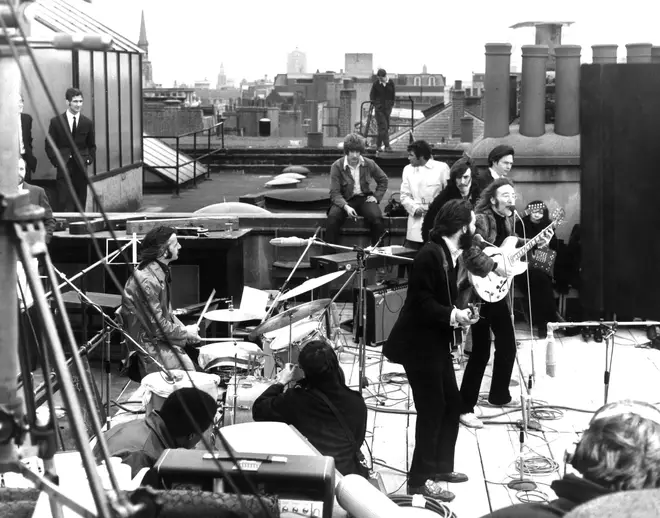 The Beatles performing their last live public concert on a rooftop in 1969